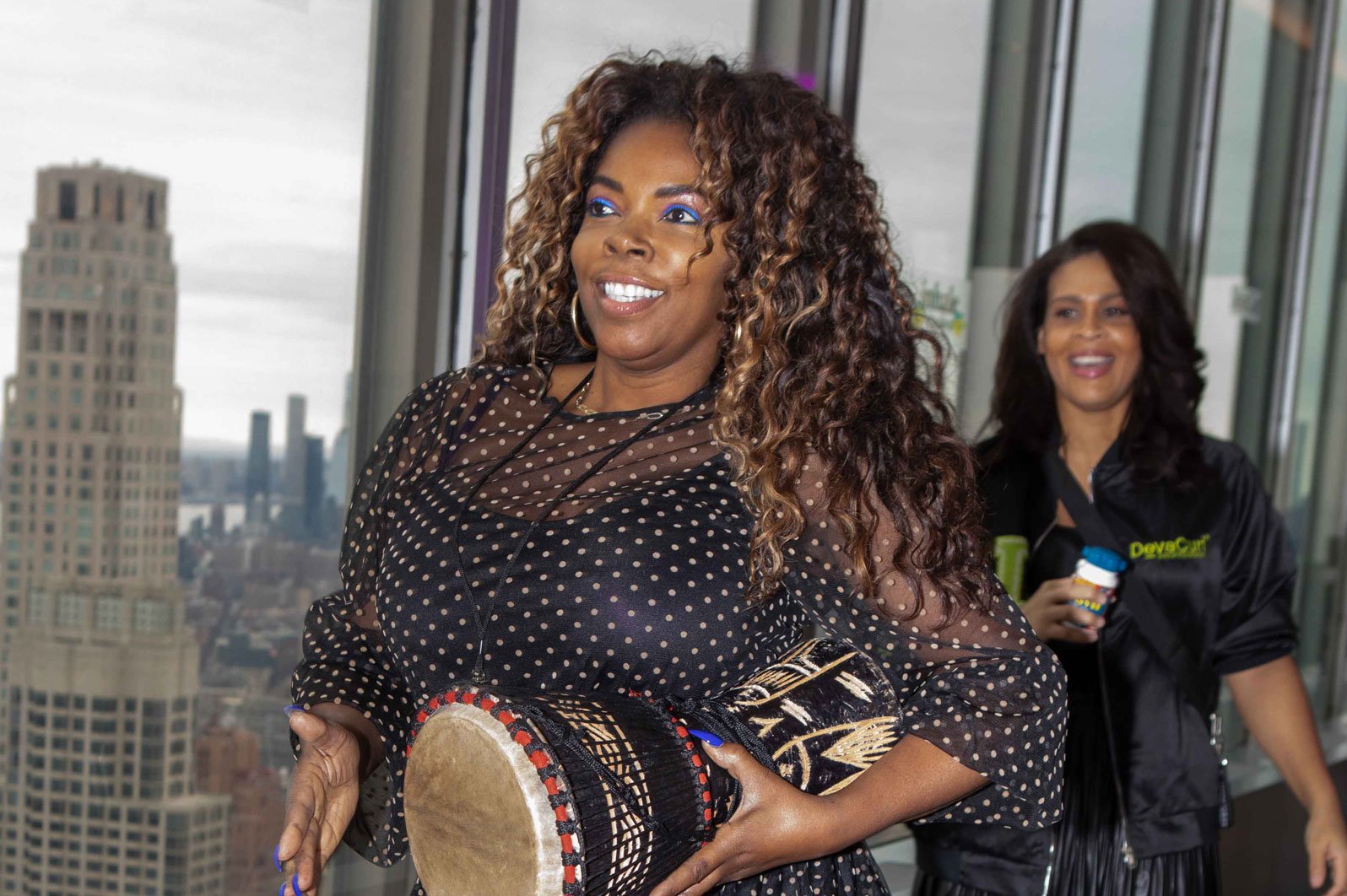 Drum Cafe Teambuilding session participant holding a drum